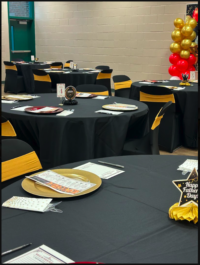 BYCC venue arranged with decorated tables for a community event